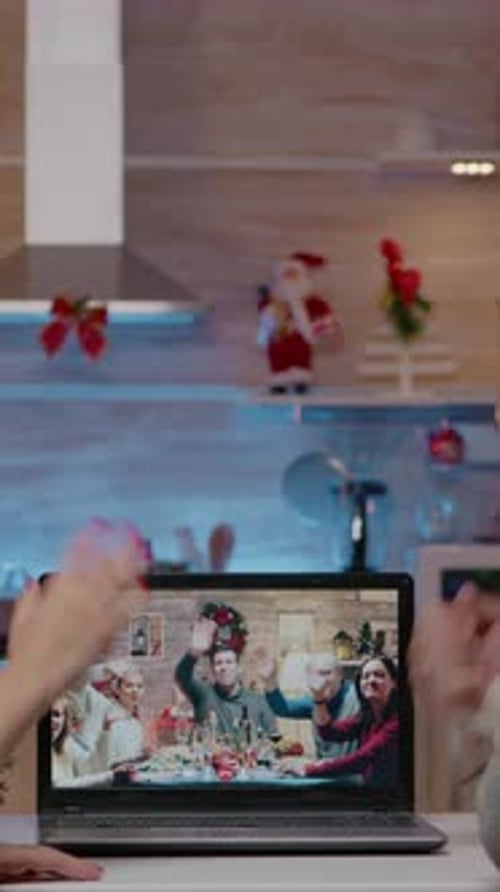Vertical Video Couple Using Video Call Talking to Family on Christmas Eve