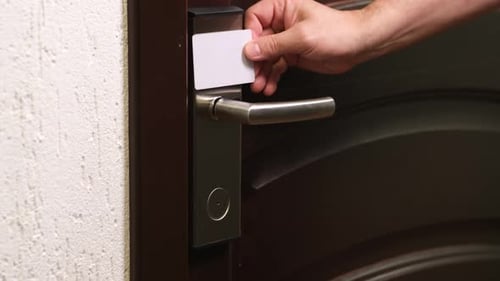 Hand Open Hotel Room Door with Electronic Magnetic Smart Card Key Close Up