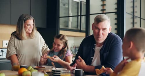 Family Enjoys Meal Together at Home