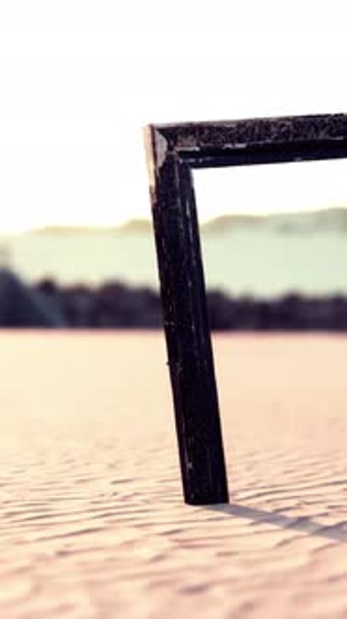 Empty Wooden Picture Frame on the Beach Sand