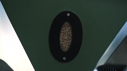 Coffee Beans Inside Roasting Machine Sight Glass Close Up