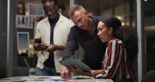 Business people, tablet and planning for design at night, creative agency