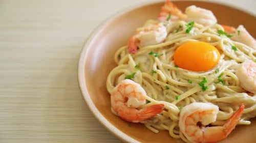Creamy Shrimp Pasta with Egg Yolk on Plate