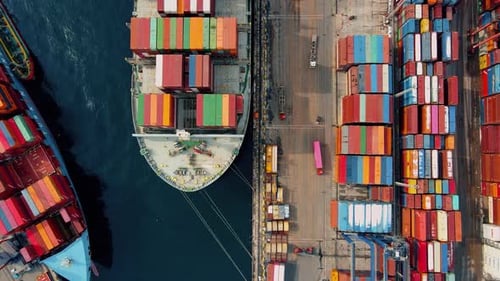Cargo Ship and Containers at Busy Port