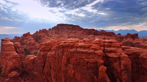 Whimsical rounded red rock columns in a large group.