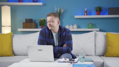 Adult Man Working Remotely on Laptop