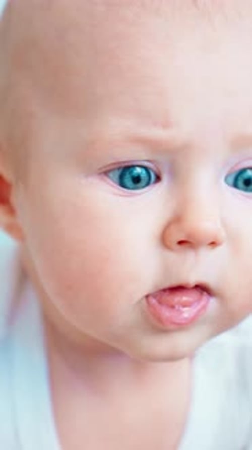Adorable Infant With Blue Eyes Close Up
