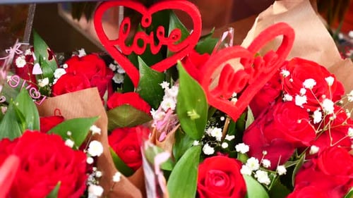 Close-up of Bouquets of Red Roses with Love Hearts
