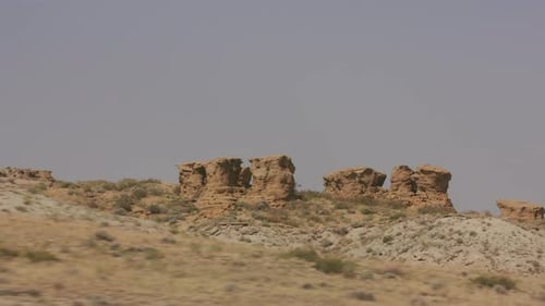 Driving by Red Cliffs in Wyoming Arid