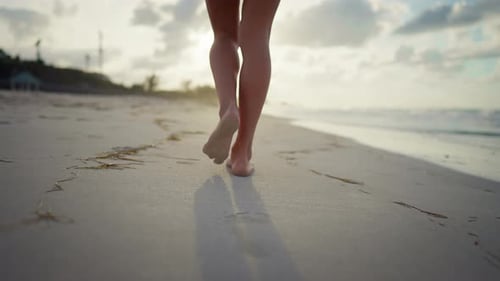 Footprints on Sand After Walk of Beautiful Slender Woman Follow Closeup Shot Relax on Ocean