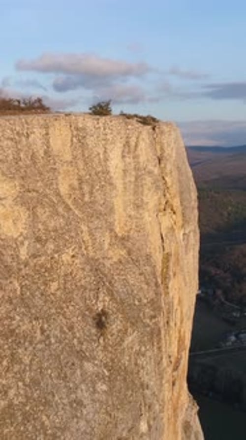 Top View of Rocky Cliff on Background Horizon of Mountains Shot Beautiful Landscape with Majestic