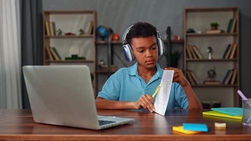 Young African American Child Boy Studying at Home Kid Sits at Desk Attends School Class Online on