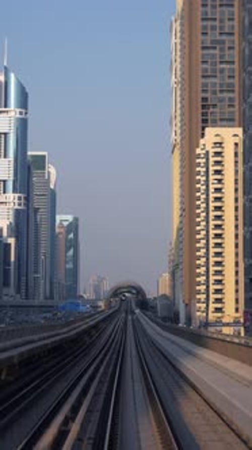 A Stunning and Futuristic Urban Cityscape That Features the Interwoven Subway Tracks