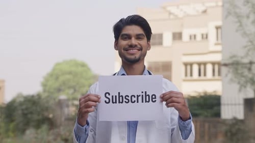 Indian Doctor Holding Subscribe Poster