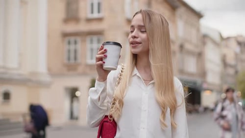 Happy Woman Girl Enjoying Drinking Morning Coffee Hot Drink Relaxing Taking a Break in City Street