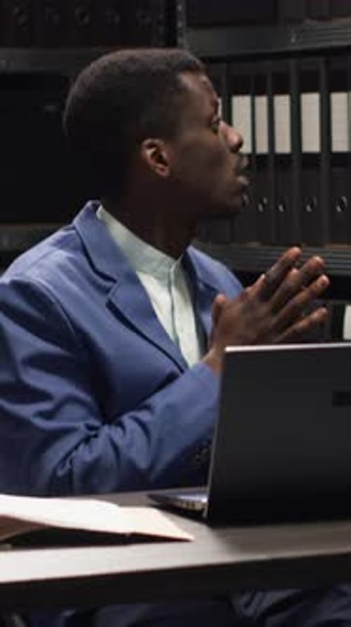 Adult Man Working at Computer in Workplace