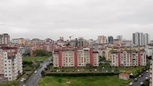 Aerial city view with apartments houses and traffic on the roads on a winter day. Onurkent, Shehzada
