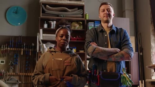 Portrait of Diverse Couple of Carpenters in Workshop