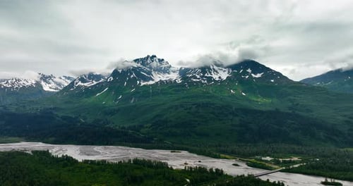 Majestic Aerial View of Snow-Capped Mountains in Alaska