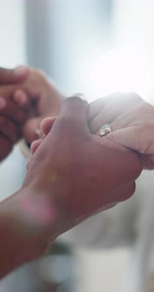 Close Up of Hands with Engagement Ring