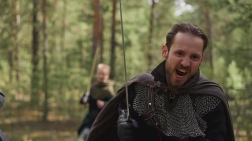 Knight with Chain Mail and Sword Runs to Attack Enemies