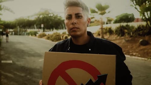 Female activist protesting against financial crisis and global inflation