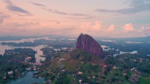 Aerial view of La Piedra del Peñol monolith and lake at sunset – Guatapé, Medellín, Colombia