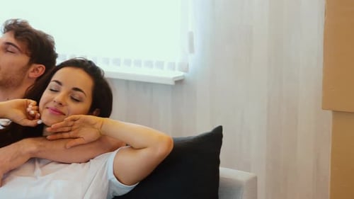 Young Couple Move Into New Apartment