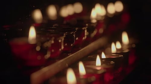 Small Red Candles Flicker in the Dark