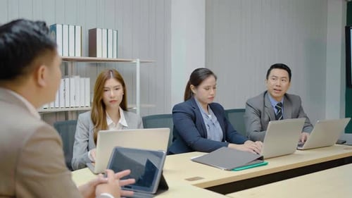Business Team Meeting in Modern Office