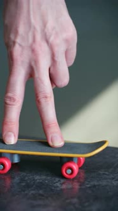 Person Performing Tricks with a Fingerboard