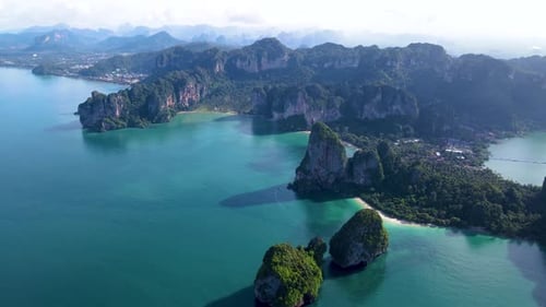 Discover Breathtaking Cliffs and Tranquil Waters of Railay Beach Krabi Thailand at Sunrise