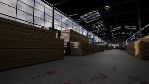 Tablas de madera apiladas en un gran almacén industrial