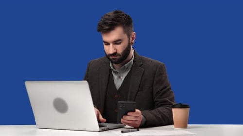 Focused Business Man Counting Checking Data Use Smartphone Laptop Isolated Blue Screen Chroma Key