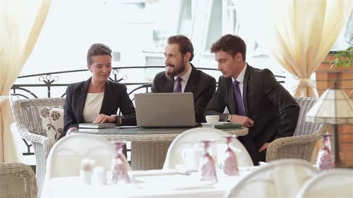 Business Meeting at Outdoor Cafe