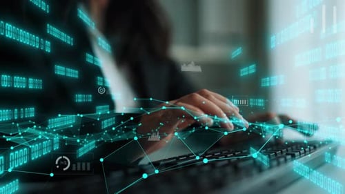 Person typing on a keyboard with digital graphs and data visualization overlay, representing technol