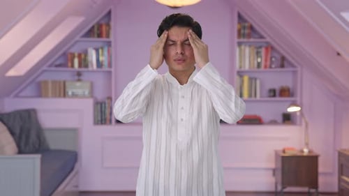 Man Massaging Head Temples Experiencing Headache