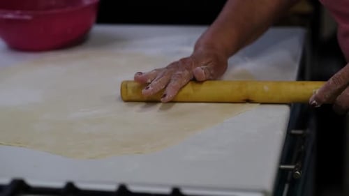 Adult Rolling Out Dough with Rolling Pin