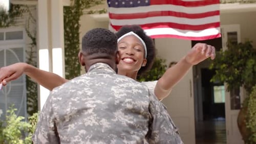 Joyful Reunion of Soldier and Family Member at Home