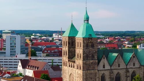 Osnabruck Cathedral Dominates the Skyline Rising Majestically Above the Old Town Rooftops in a
