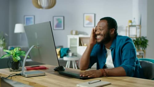 Includes Audio: Handsome Man Has Fun while Using Personal Computer at Home, Watching Funny Videos o