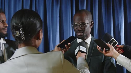 Politician Giving Press Conference in Urban Setting