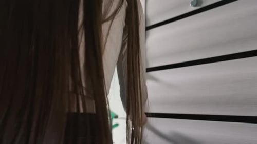 Woman Receiving Food Delivery at Apartment Door