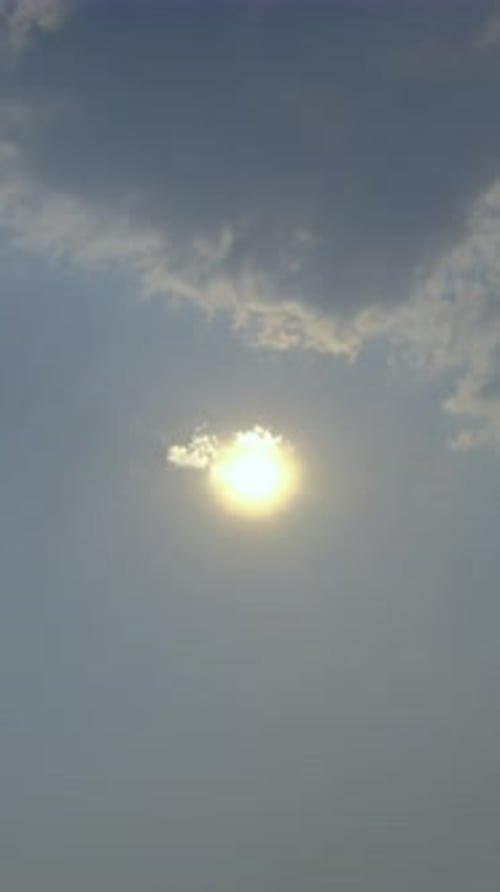 Sunlight Bursts Through Clouds in Sky
