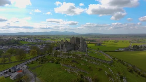 Aerial view of the Rock of Cashel, capturing ancient stone walls, round towers, and cathedral ruins