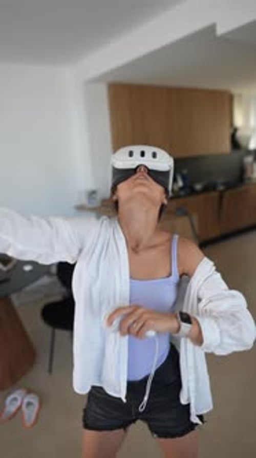 Woman Using Virtual Reality Headset Indoors
