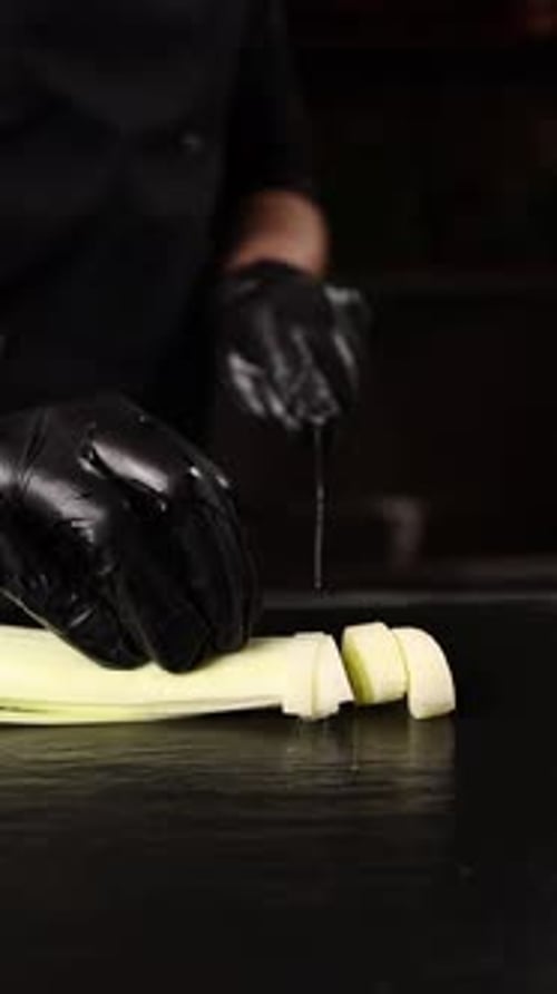 The chef prepares a vegetable dish.