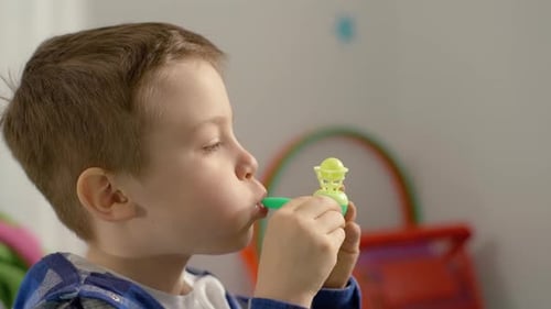 Child Blowing Toy Air Game Indoors