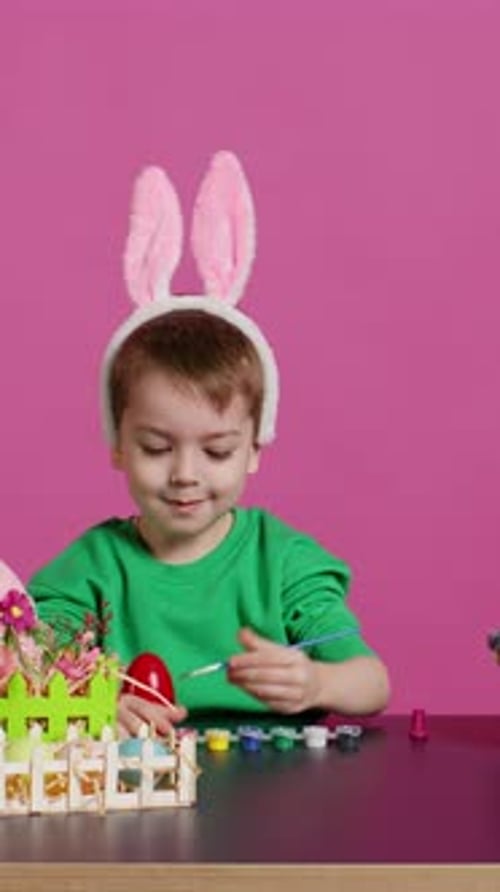 Adorable Little Youngster Creates Handcrafted Ornaments for Easter Sunday
