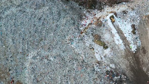 Aerial View of Garbage Pile in Trash Dump Bulldozer Woving Waste on Landfill Biohazard for Ecosystem